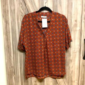 NWT short sleeve blouse, Rust color with navy blue pattern, size small.